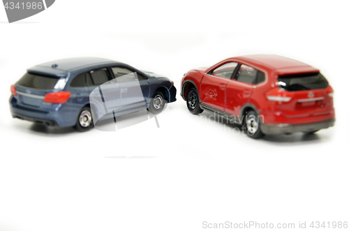 Image of Small blue and red toy cars