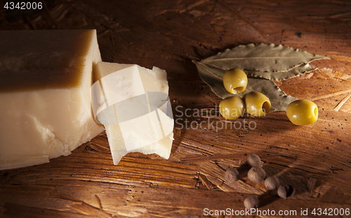 Image of parmesan cheese and green olives