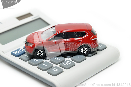 Image of Calculator and red toy car