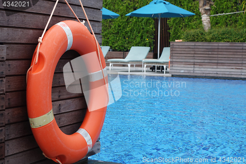 Image of Life ring orange color hanging at wall