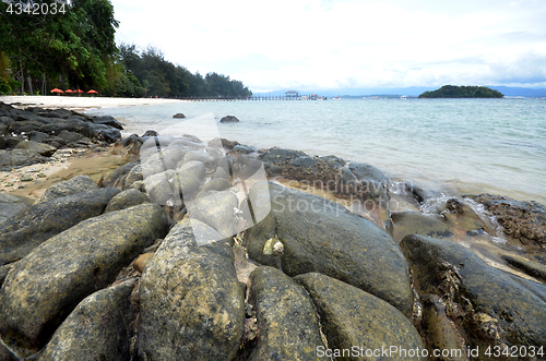 Image of Cloudy and rocky beach in Manukan island
