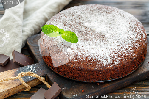 Image of Chocolate cake dusted with powdered sugar.