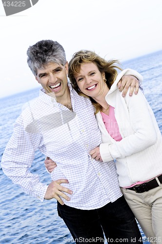 Image of Mature romantic couple at seashore