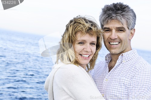 Image of Mature romantic couple at seashore