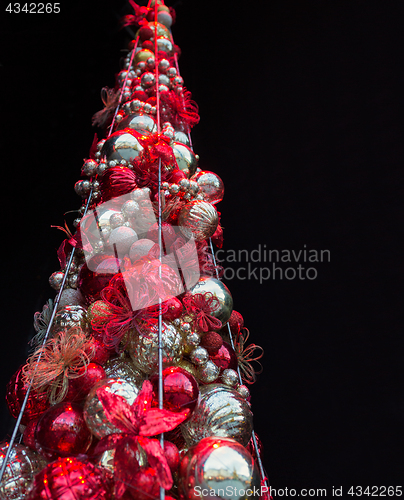 Image of close up of artificial christmas tree toys