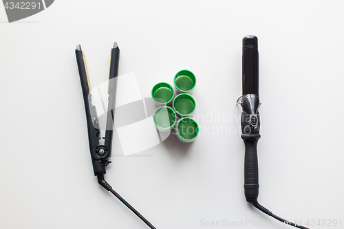 Image of curling iron, hot styler and hair curlers