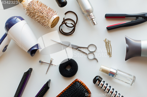 Image of scissors, hairdryers, irons and brushes