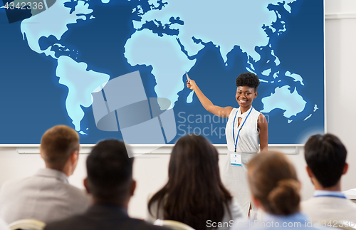 Image of group of people at business conference or lecture