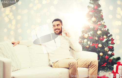 Image of man calling on smartphone for christmas