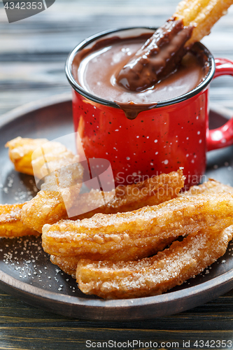 Image of Churros with hot chocolate.