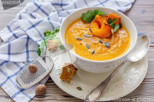 Image of Spicy pumpkin soup with greens.