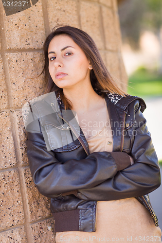 Image of Beautiful Meloncholy Mixed Race Young Woman Portrait Outside.