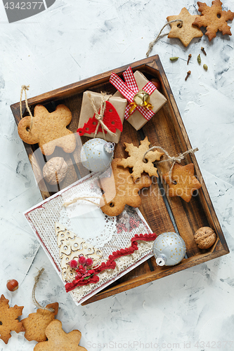 Image of Christmas cookies,gifts,greeting card and silver balls.