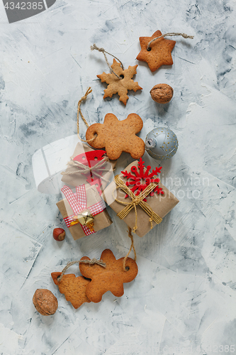 Image of Christmas gingerbread and gifts with festive decor.