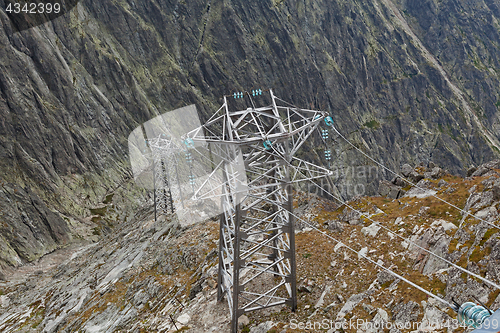 Image of Electric power line in extremely high rocky mountains