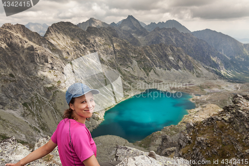 Image of Hiking woman admiring the beauty of rocky Tatra mountains