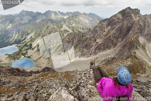 Image of Hiking woman admiring the beauty of rocky Tatra mountains