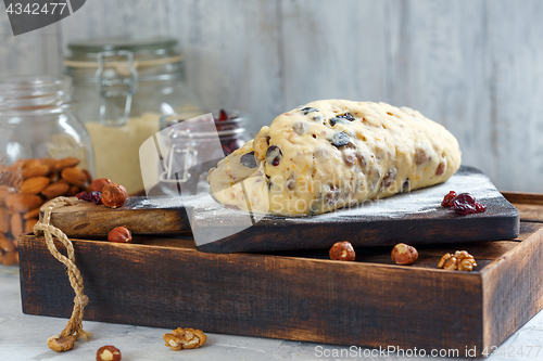 Image of Traditional Christmas Stollen on a floured board.