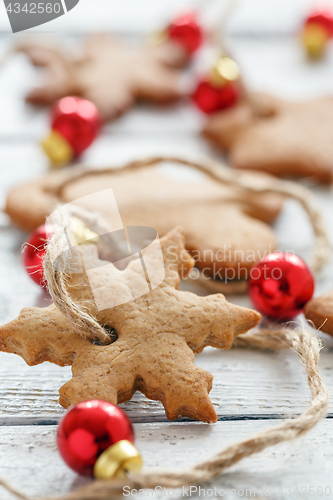 Image of Garland from Christmas cookies and red balls.