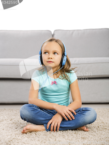 Image of Cute girl listen music