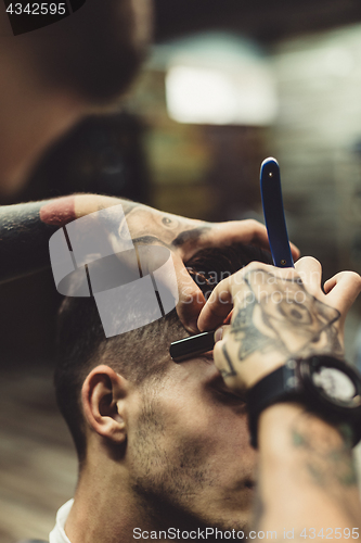 Image of Barber shaving client