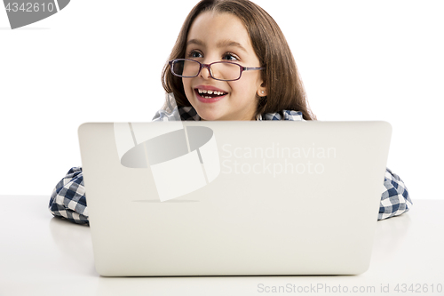 Image of Little girl working with a laptop