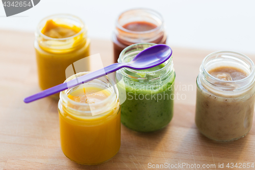 Image of vegetable or fruit puree or baby food in jars