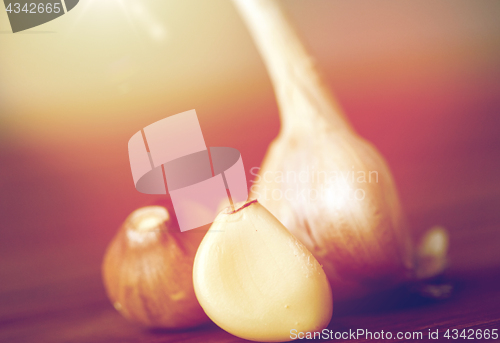 Image of close up of garlic on wooden table