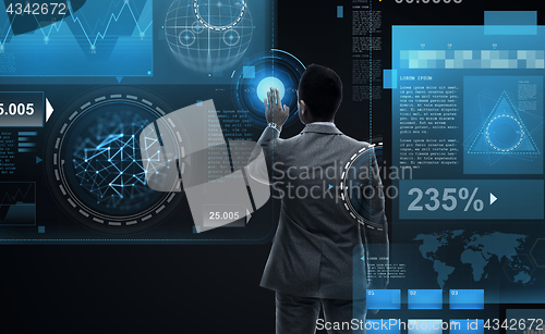 Image of businessman working with virtual reality screens