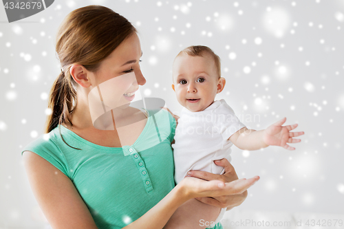 Image of happy young mother with little baby