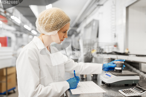 Image of woman working at ice cream factory