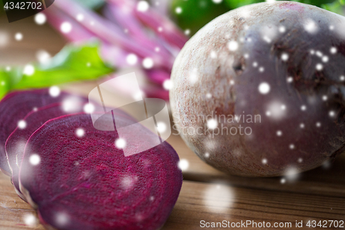 Image of close up of sliced beet on wood