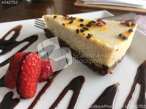 Image of AIP Paleo Cashew Milk cheesecake on a plate in wellness cafe