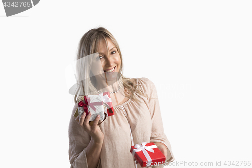 Image of Woman holding wrapped gifts presents birthdays Christmas