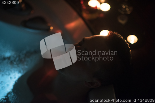 Image of man relaxing in the jacuzzi