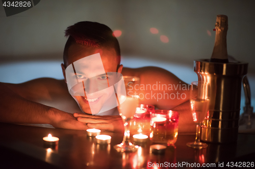 Image of man relaxing in the jacuzzi