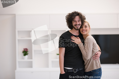 Image of couple hugging in their new home