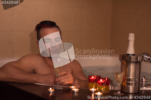 Image of man relaxing in the jacuzzi