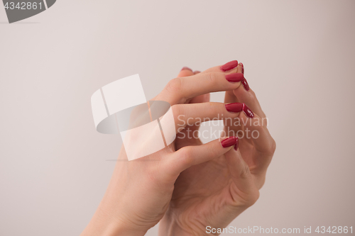 Image of closeup of hands of a young woman