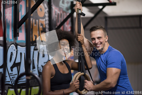 Image of Portrait of multiethnic couple  after workout at gym