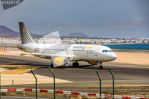 Image of ARECIFE, SPAIN - APRIL, 15 2017: AirBus A320 of vueling.com with