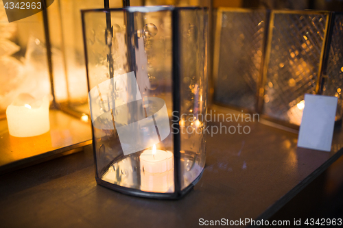 Image of close up of lantern with candle burning inside