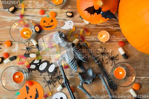 Image of halloween decorations and candies wooden boards