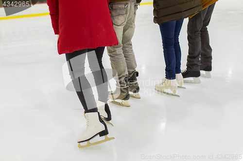 Image of close up of friends on skating rink