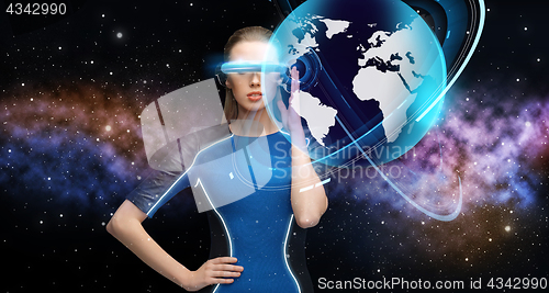 Image of woman in virtual reality 3d glasses with earth