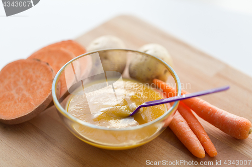 Image of vegetable puree or baby food in bowl with spoon