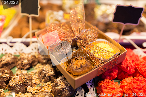 Image of craft sweets and cookies at christmas market stall