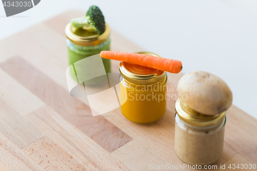 Image of vegetable puree or baby food in glass jars