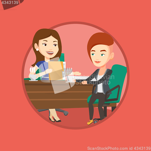 Image of Two businesswomen during business meeting.