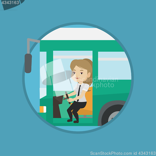 Image of Caucasian bus driver sitting at steering wheel.